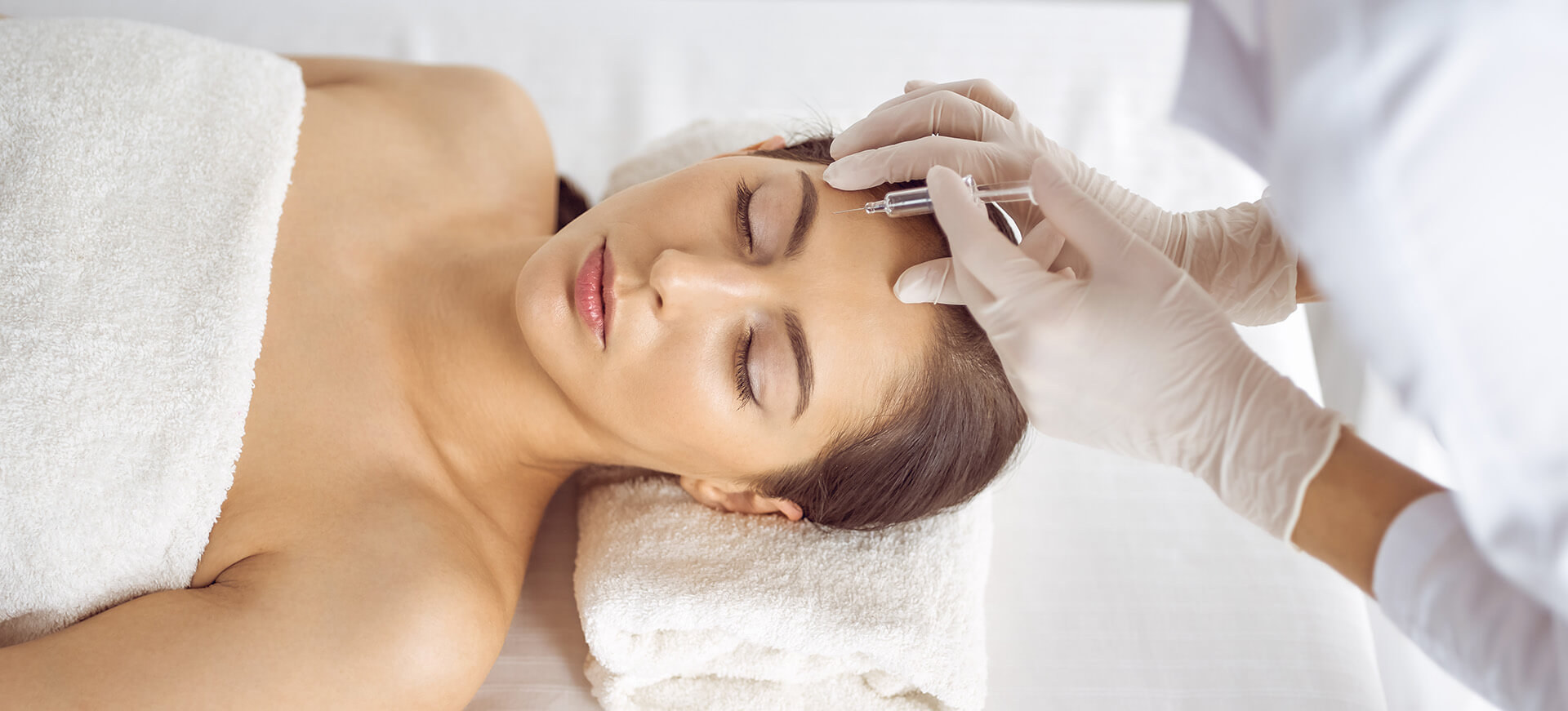 beautician-doing-beauty-procedure-with-syringe-face-young-brunette-woman-cosmetic-medicine-surgery-beauty-injections Woman getting a botox injection at Omnia Integrative Health & MedSpa in West Lawn, PA