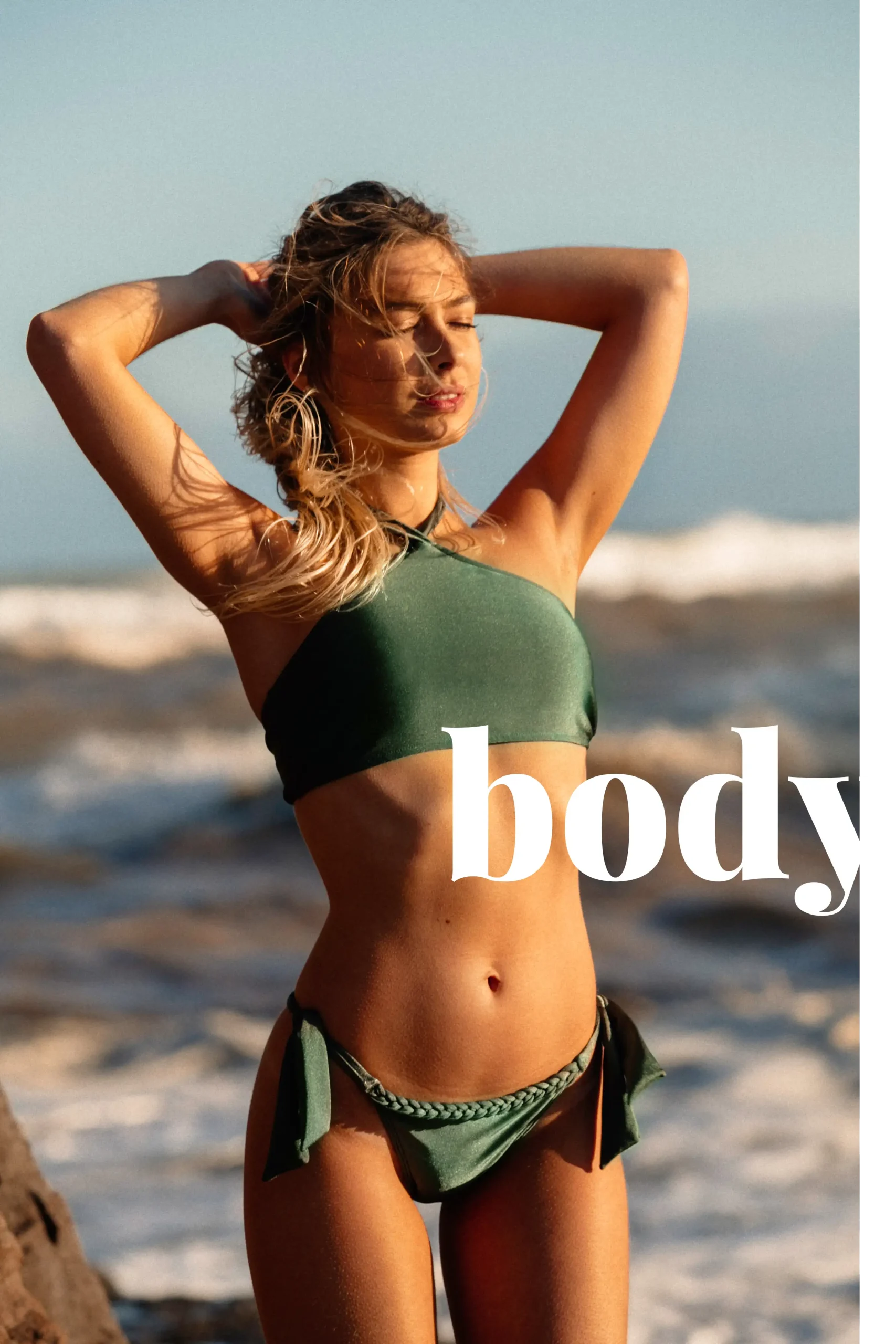 body Woman in bathing suit at the beach after getting treatments at Omnia Integrative Health & MedSpa