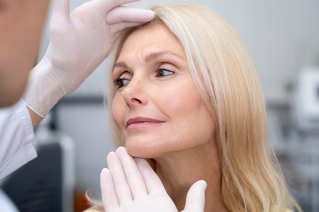 close-up-doctor-checking-woman Woman at Omnia Integrative Health & MedSpa in West Lawn, PA