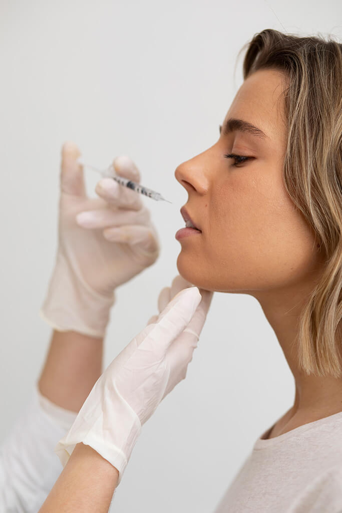 Woman getting lip filler at Omnia Integrative Health & MedSpa in Reading, PA
