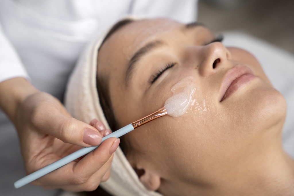 high-angle-woman-getting-massaged-spa Woman getting a Derma Peel Facial